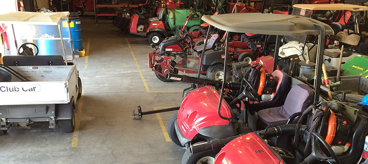 golf course maintenance equipment lined up